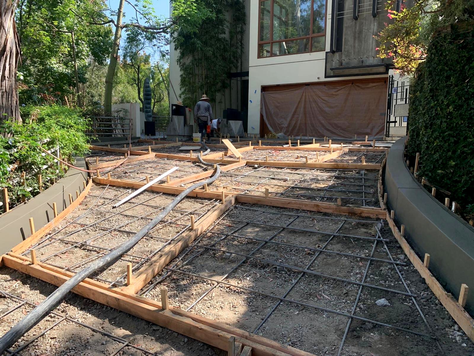 Curved concrete walkway before — rebar and forms in progress, Los Angeles