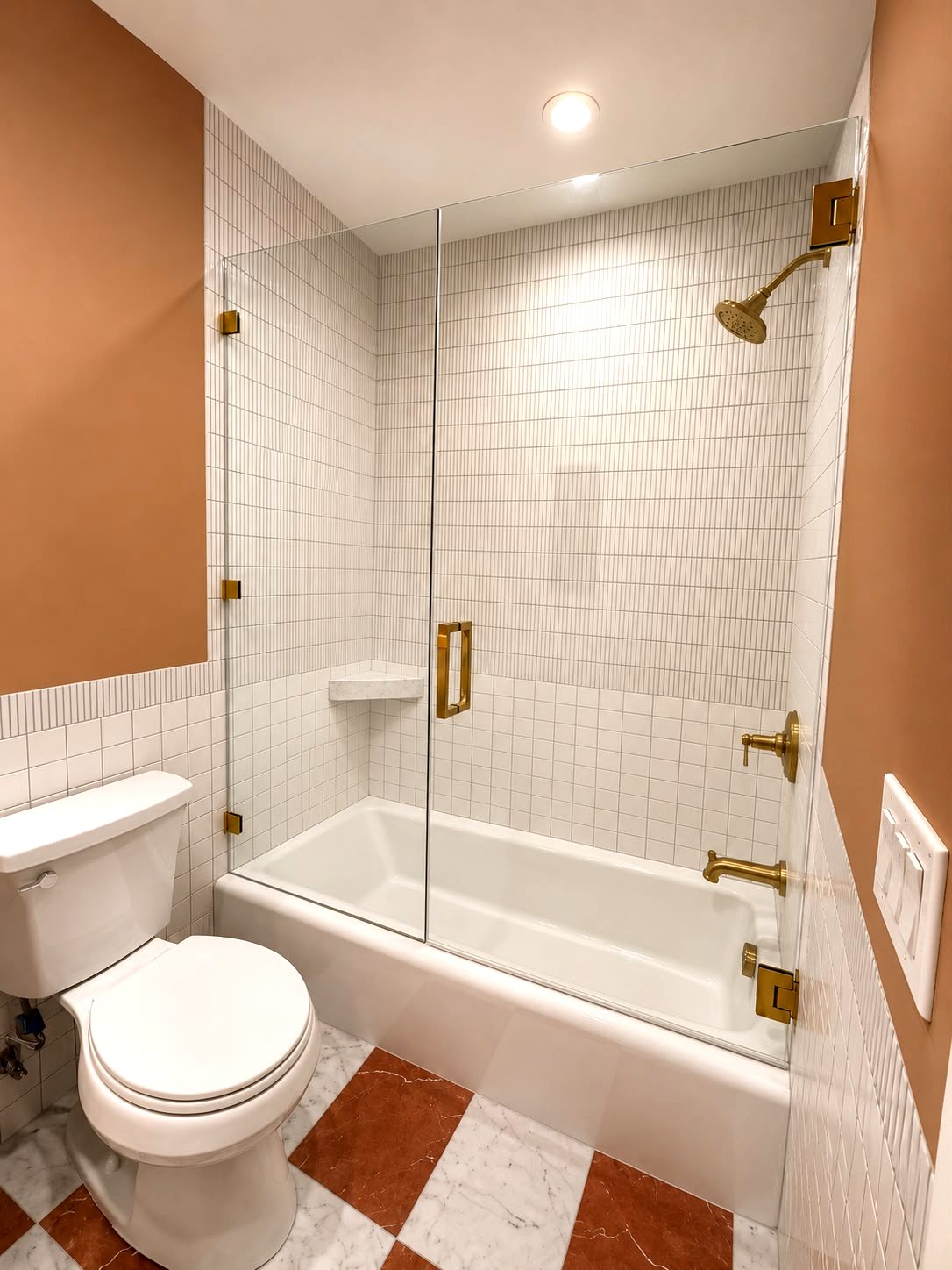 Bathroom remodel with terracotta walls and checkered marble floor — Los Angeles